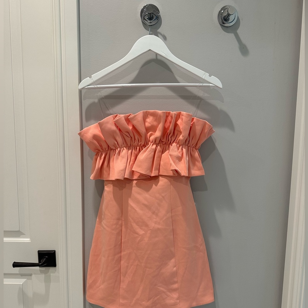 Color mini dress. Ruffle chest. Tie in back.